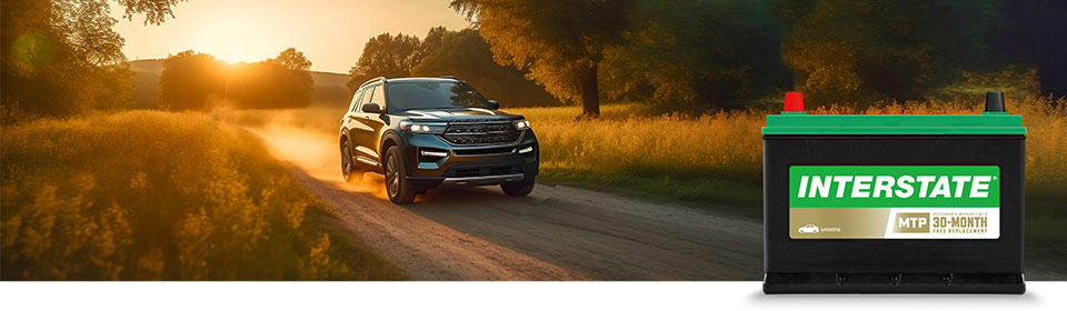 Ford SUV driving down road with Interstate MTP battery